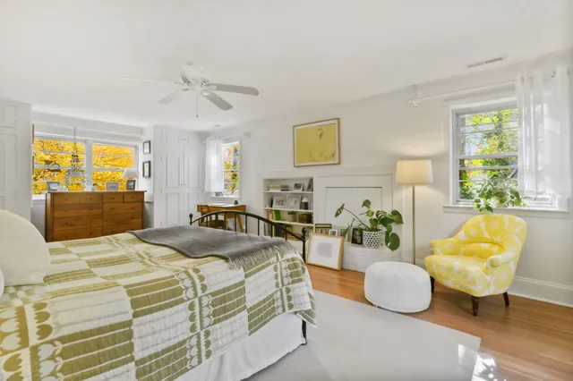 a bedroom with a bed and couch