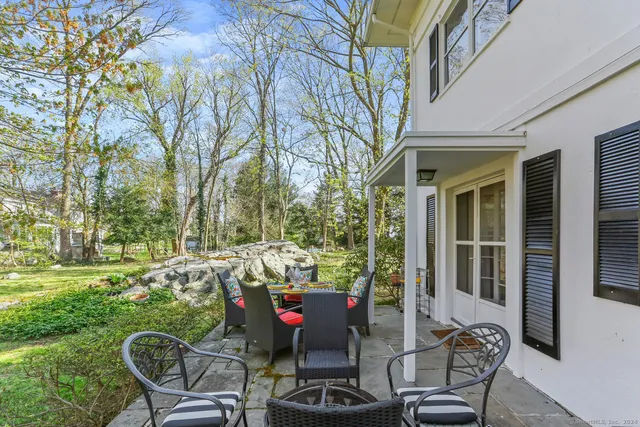 a view of a chairs and table in the patio