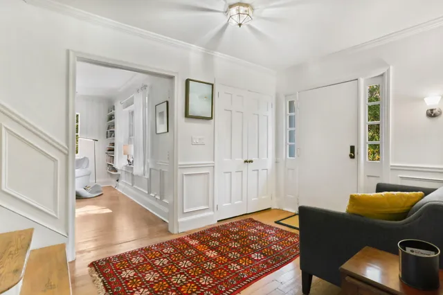 a living room with furniture and a rug