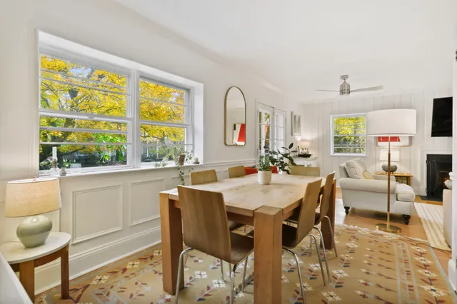 a view of a dining room with furniture window and outside view