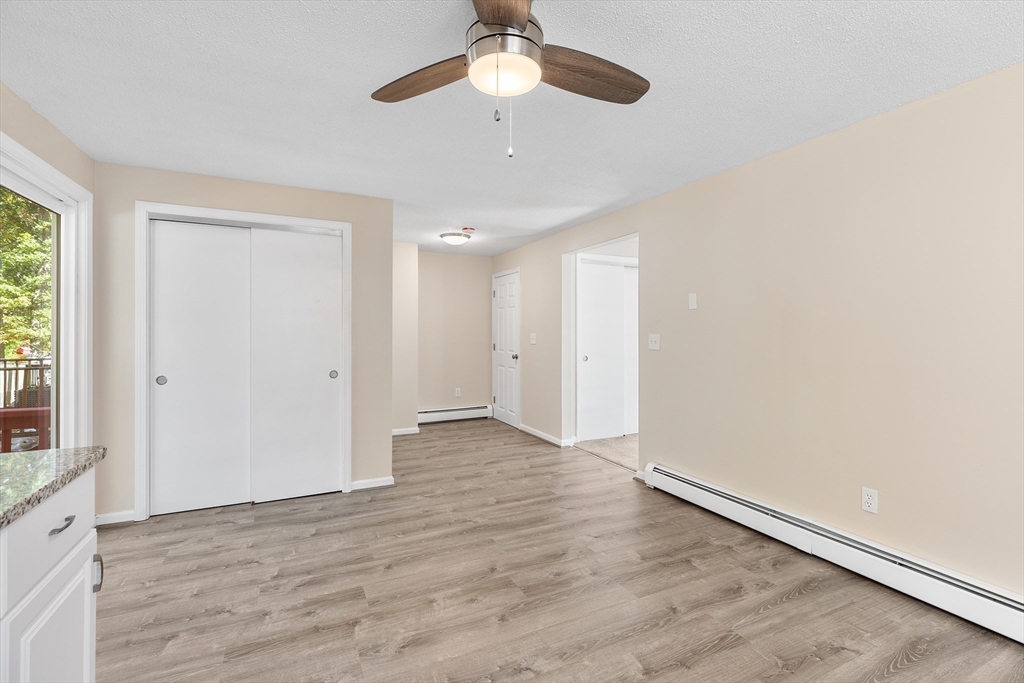 56 Vincent Circle Worcester, MA 01604 - Photo 6 of 23 wooden floor in an empty room with a window