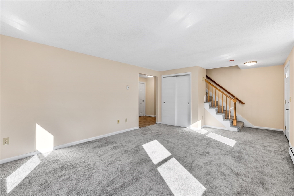 56 Vincent Circle Worcester, MA 01604 - Photo 9 of 23 a view of an empty room with stairs