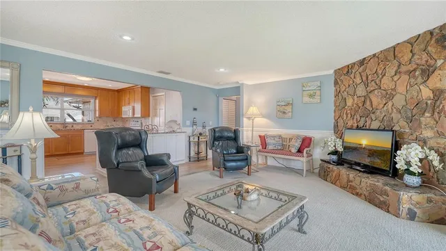 a kitchen with stainless steel appliances granite countertop sink stove and wooden cabinets