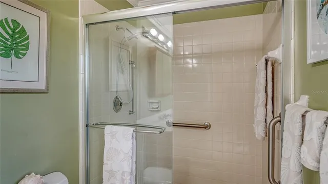 a view of a living room and floor to ceiling window