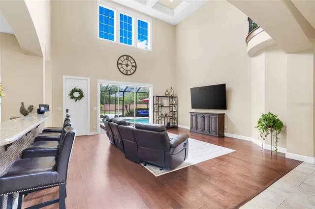 a kitchen with stainless steel appliances granite countertop a refrigerator a oven and a sink