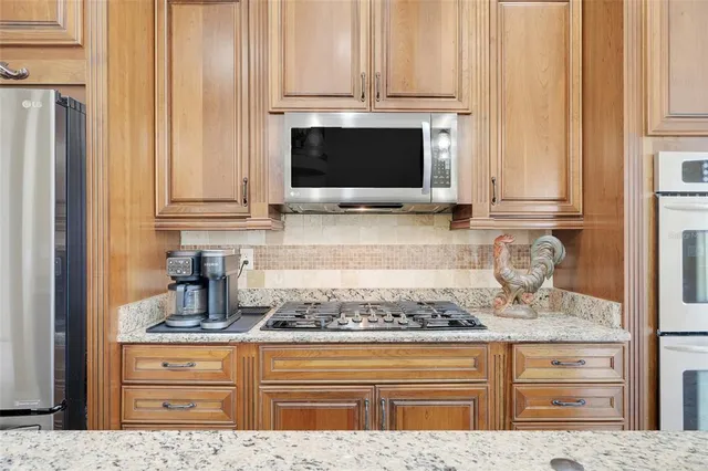 a spacious bedroom with a bed and a table in it