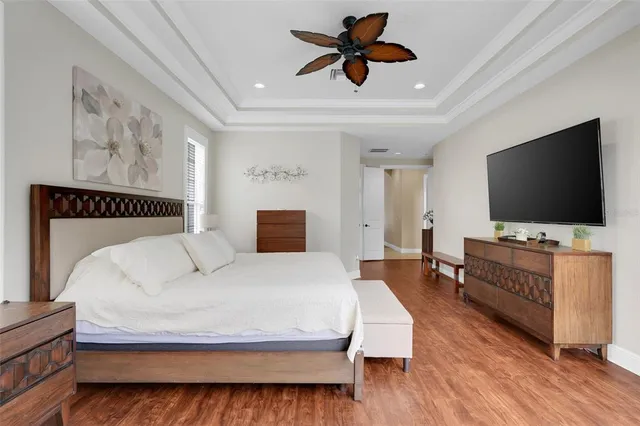 a bedroom with a large bed and a window