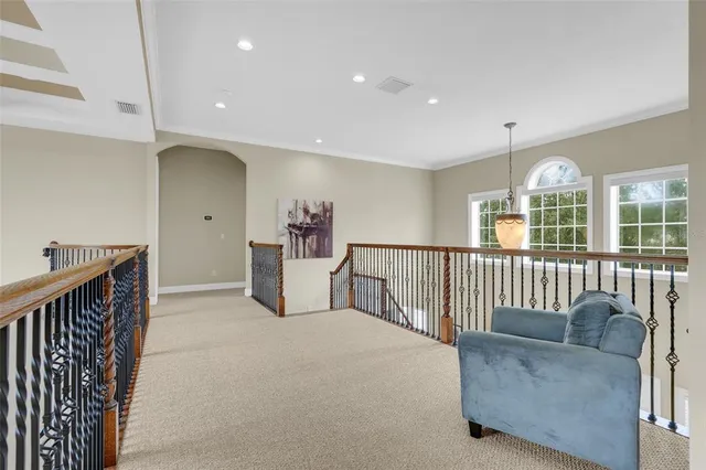 a bathroom with a granite countertop toilet a mirror and a window