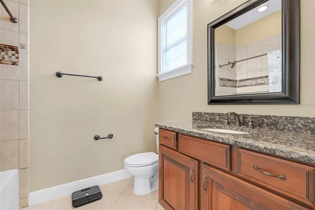 a view of a patio with a table and chairs under an umbrella