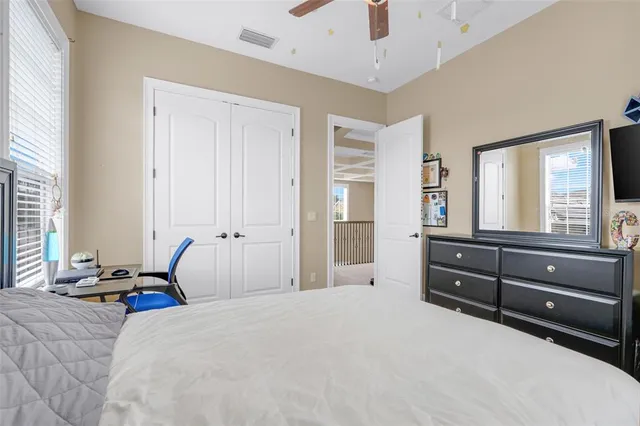 a dining room with stainless steel appliances kitchen island granite countertop a table chairs a sink and dishwasher