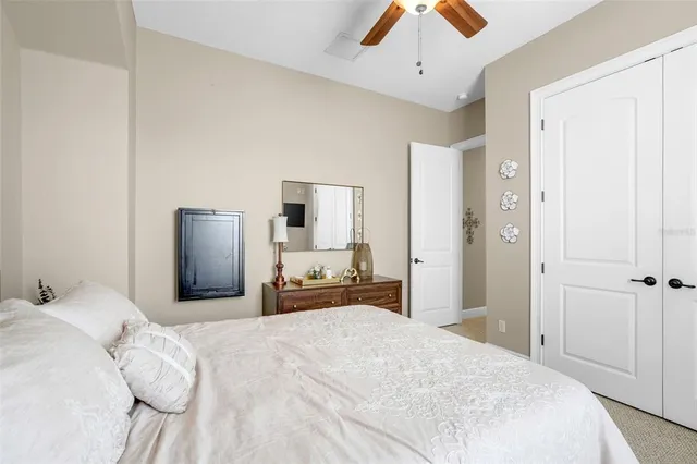 an aerial view of residential houses with outdoor space and trees