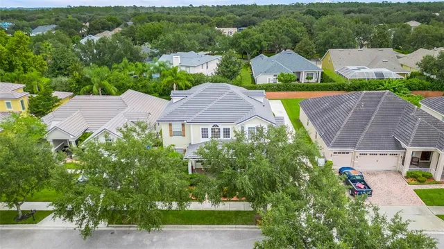 an aerial view of multiple houses on a city street