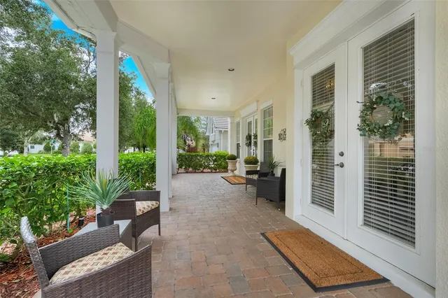 a view of a livingroom with furniture window and wooden floor