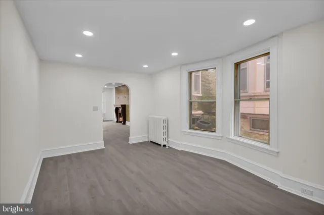 a kitchen with stainless steel appliances granite countertop a refrigerator sink and stove