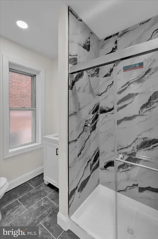 a bathroom with a sink and a window