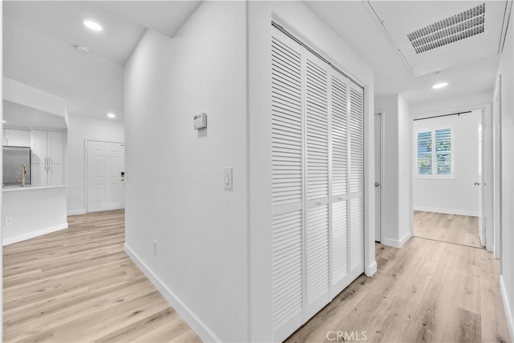 31231 Taylor Lane Temecula, CA 92592 - Photo 13 of 27 a view of a hallway with wooden floor and staircase