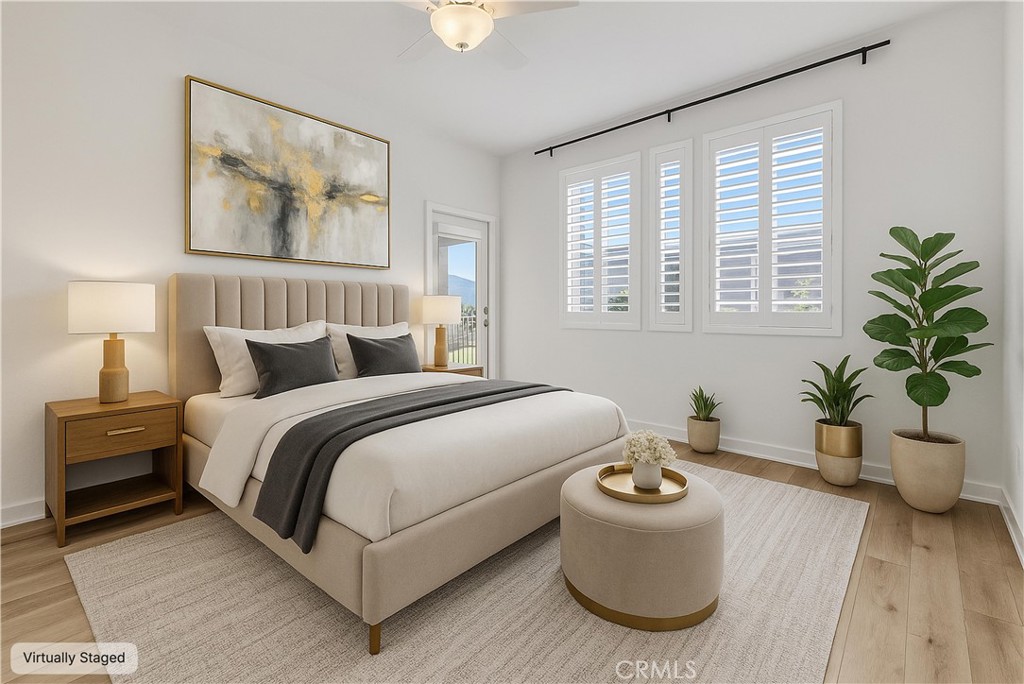 31231 Taylor Lane Temecula, CA 92592 - Photo 15 of 27 a bedroom with a balcony a large bed and a potted plant
