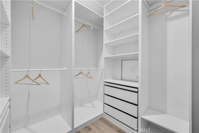 a view of an empty walk in closet