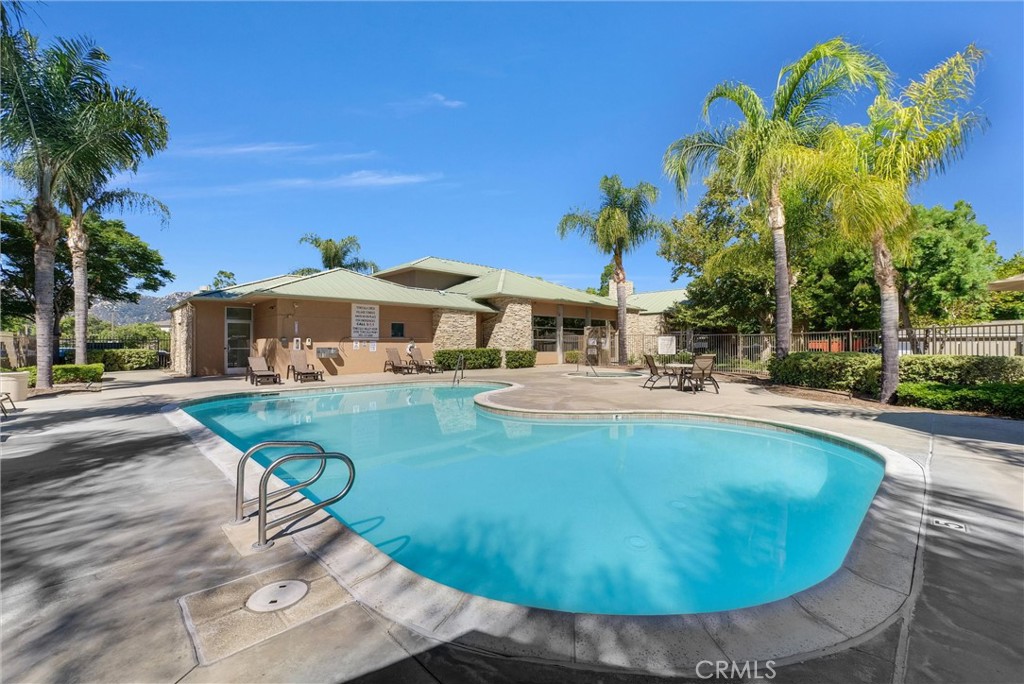 31231 Taylor Lane Temecula, CA 92592 - Photo 21 of 27 a view of a white house with a swimming pool