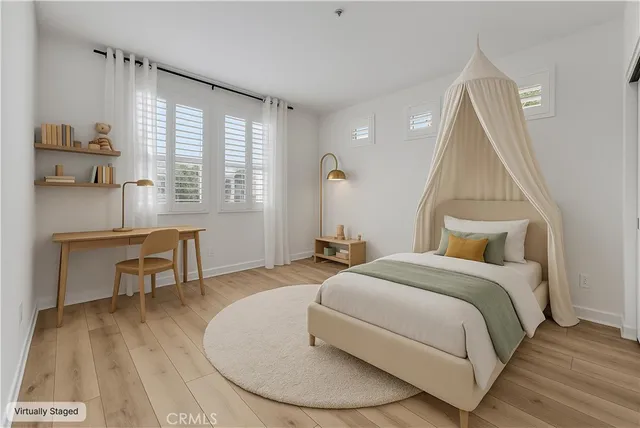 a bedroom with a bed and a table