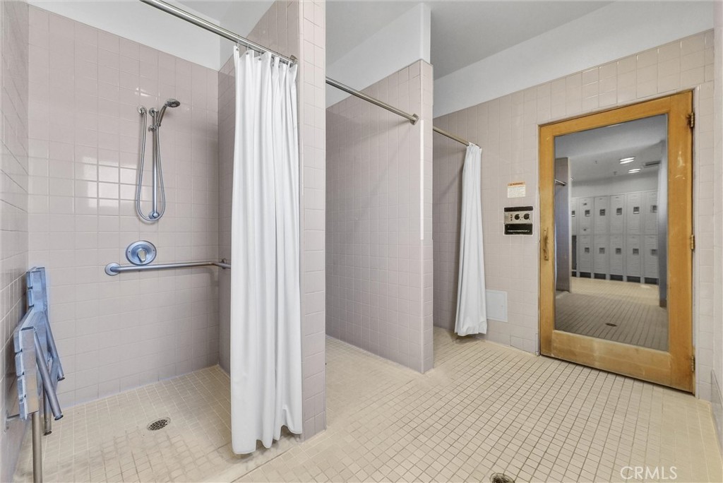 31231 Taylor Lane Temecula, CA 92592 - Photo 24 of 27 a bathroom with a shower and a glass door