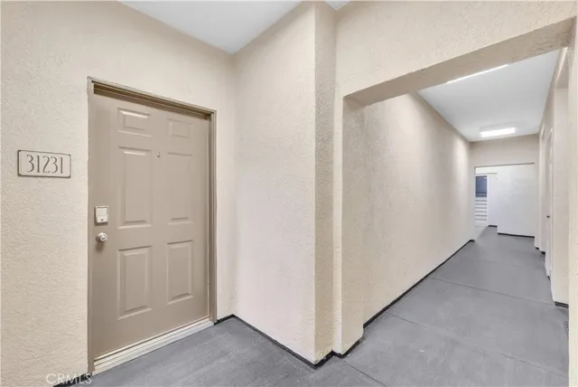 a view of a hallway with closet area