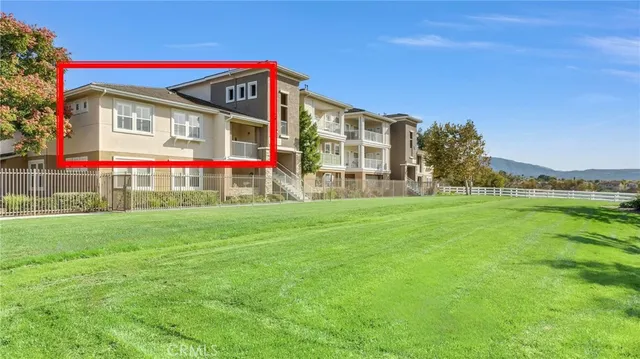 a view of a house with backyard and garden