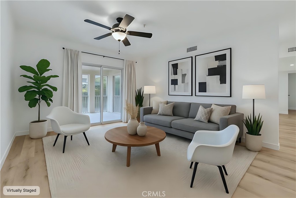 31231 Taylor Lane Temecula, CA 92592 - Photo 6 of 27 a living room with furniture and a potted plant