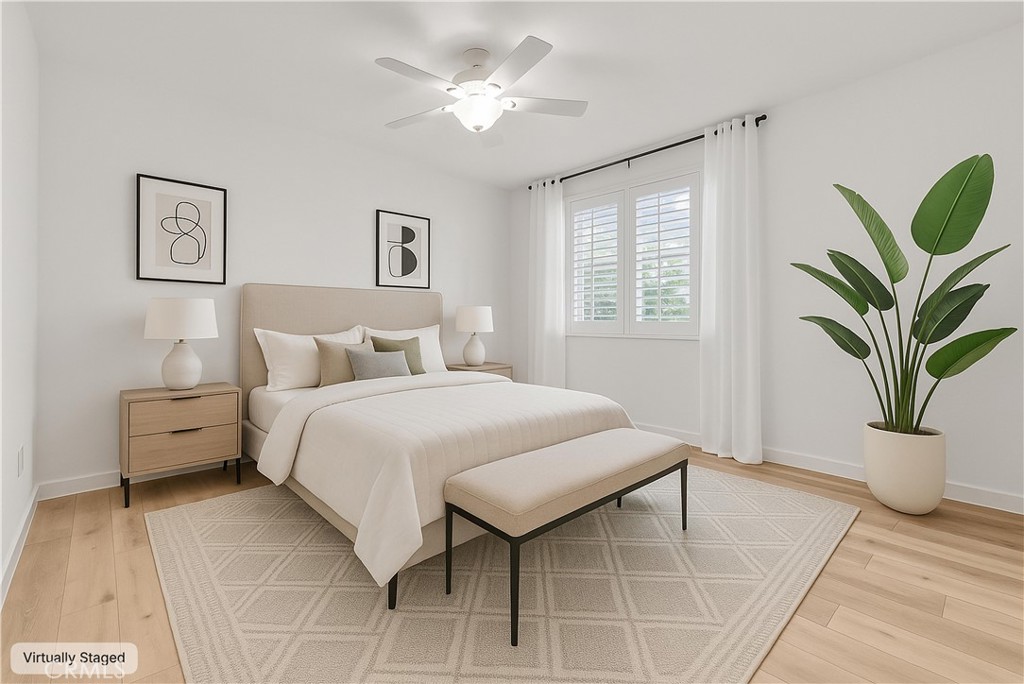 31231 Taylor Lane Temecula, CA 92592 - Photo 9 of 27 a bedroom with a bed and a potted plant