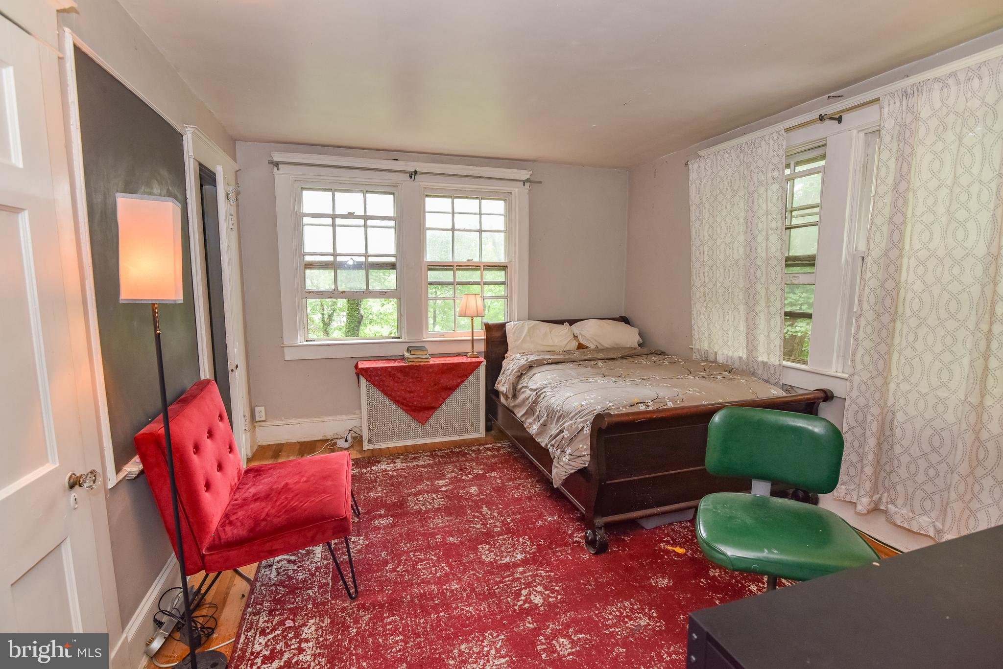 24 Merrymount Road Baltimore, MD 21210 - Photo 23 of 48 a bedroom with a bed chair and a window