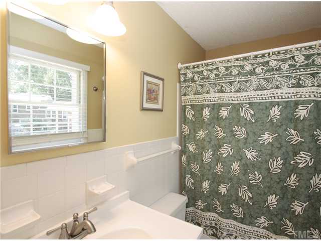5404 Christman Court Raleigh, NC 27609 - Photo 11 of 20 a bathroom with a bathtub and shower