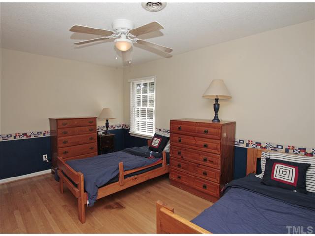 5404 Christman Court Raleigh, NC 27609 - Photo 14 of 20 a living room with furniture and a ceiling fan
