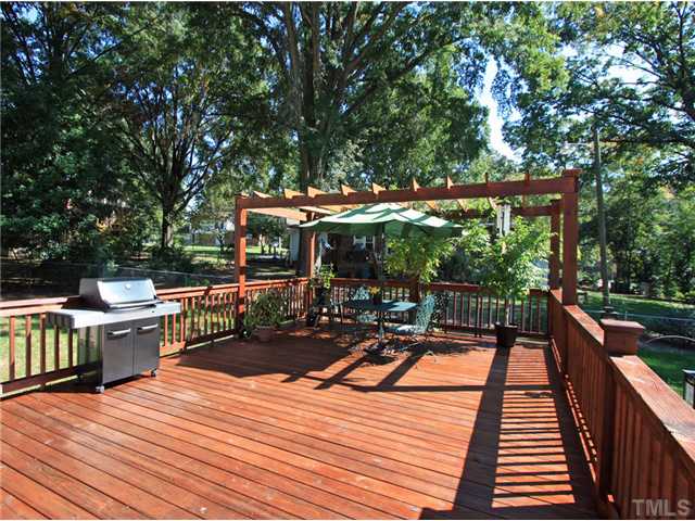 5404 Christman Court Raleigh, NC 27609 - Photo 18 of 20 a view of a patio with wooden floor yard barbeque oven and outdoor seating