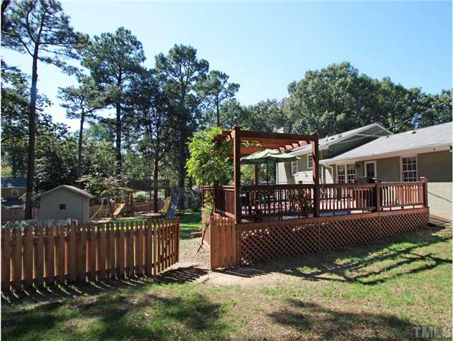 5404 Christman Court Raleigh, NC 27609 - Photo 19 of 20 a view of a house with a yard