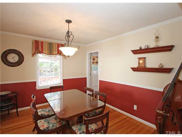 5404 Christman Court Raleigh, NC 27609 - Photo 5 of 20 a view of a dining room with furniture and chandelier