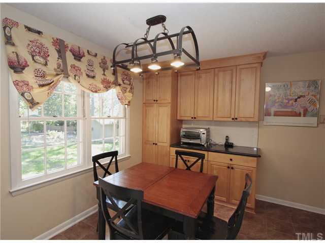 5404 Christman Court Raleigh, NC 27609 - Photo 9 of 20 a view of a dining room with furniture window and outside view