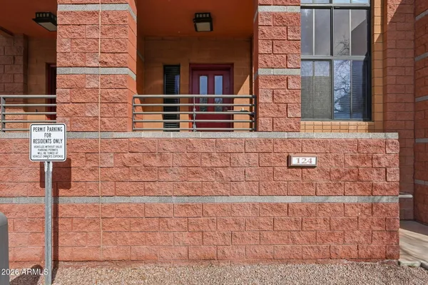 a view of a brick building with many windows