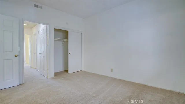 a view of a bathroom from a hallway
