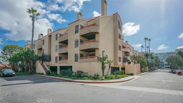 an aerial view of a house with a yard and potted plants