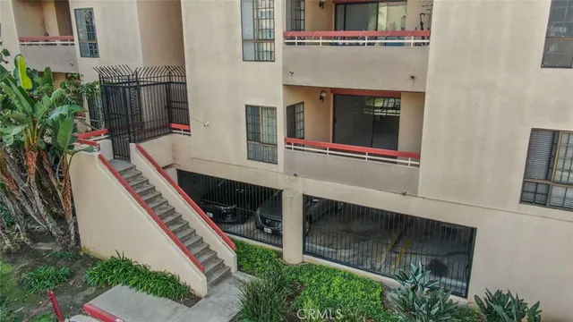 an aerial view of residential house with outdoor space and trees all around