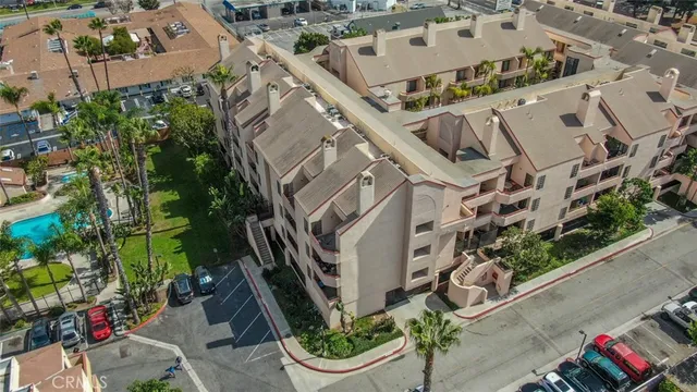 an aerial view of a house with garden space and street view
