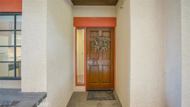 a kitchen with a refrigerator sink and cabinets