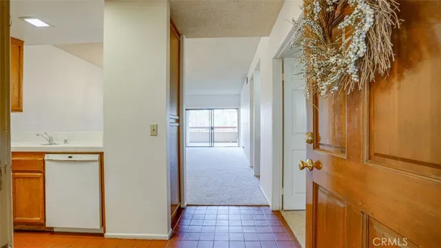 a kitchen with a sink cabinets and stainless steel appliances