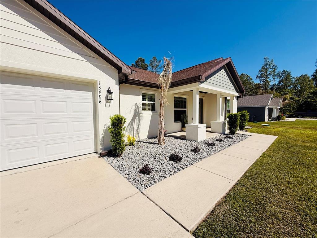 13486 English Sparrow Road Weeki Wachee, FL 34614 - Photo 3 of 51 a view of a house with backyard and sitting area