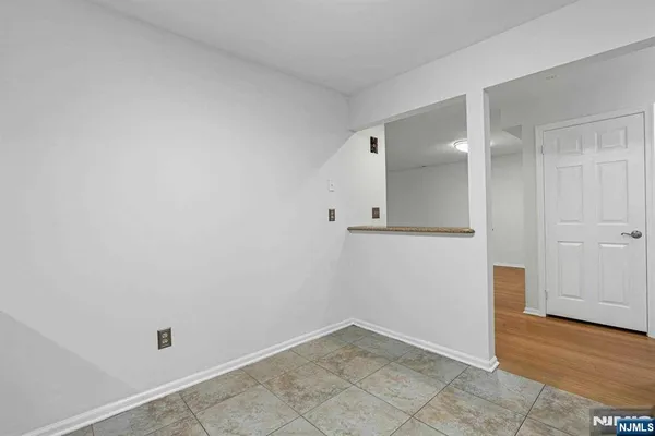 an empty room with wooden floor