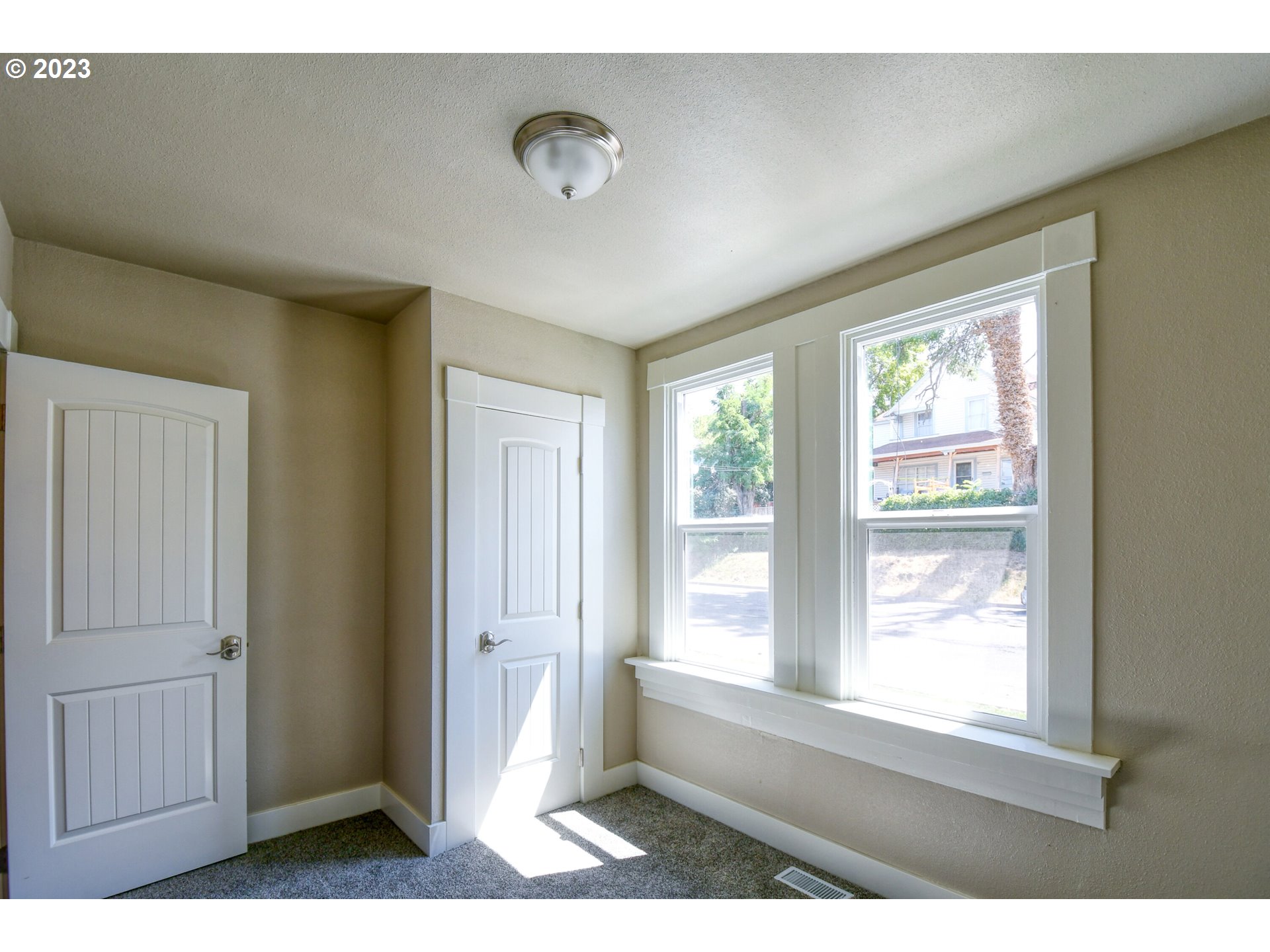 728 Southwest 3rd Street Pendleton, OR 97801 - Photo 15 of 30 a view of an empty room with wooden floor and a window