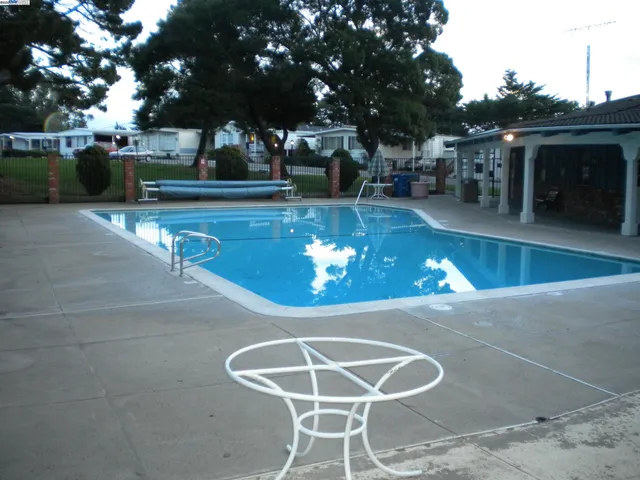 a view of a swimming pool with a patio