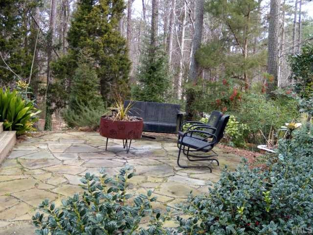8804 Boar's Head Court Raleigh, NC 27613 - Photo 12 of 12 In addition to the screened porch and the deck, this fire pit patio was built with relaxation and/or entertaining in mind! Patio/Deck