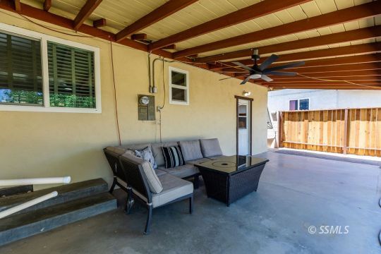 240 West Graaf Avenue Ridgecrest, CA 93555 - Photo 23 of 28 a living room with furniture and a flat screen tv
