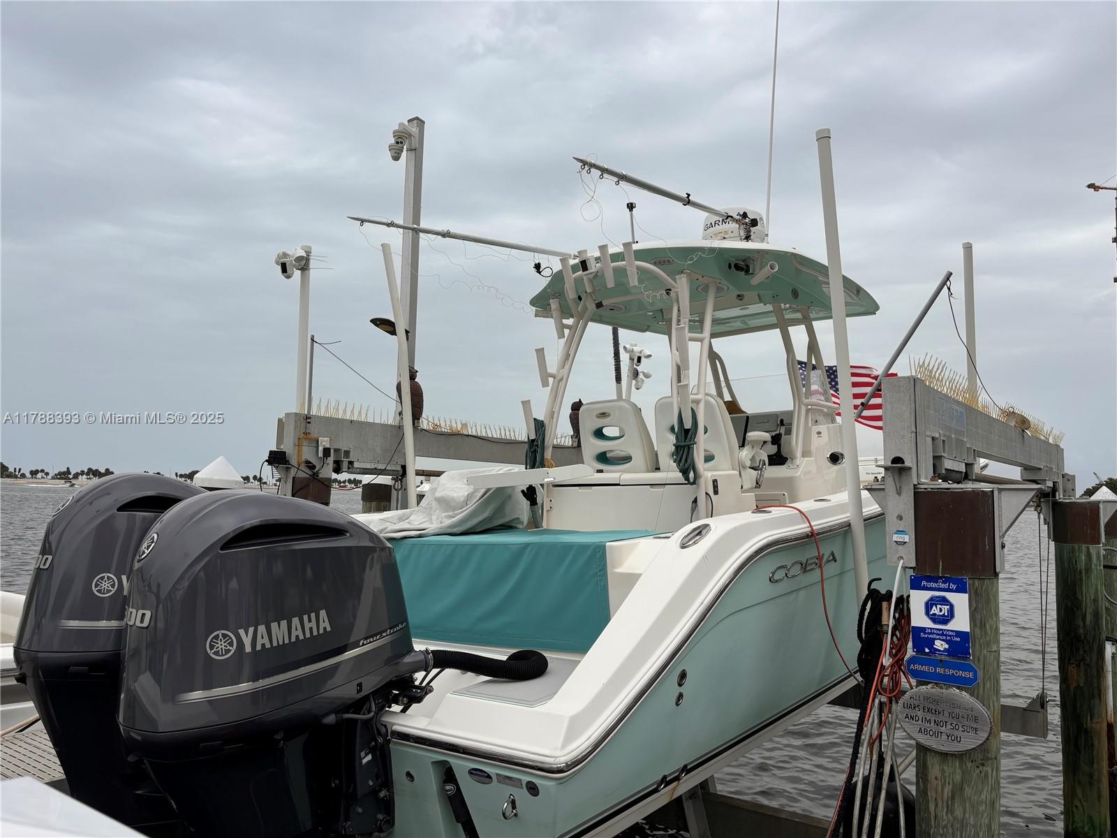 1915 Brickell Avenue Miami, FL 33129 - Photo 2 of 6 a view of a dining room with furniture and floor to ceiling window